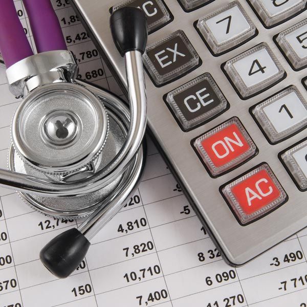 Stethoscope next to calculator