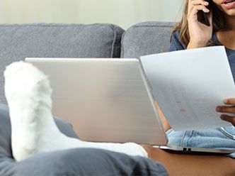 Woman in cast on phone